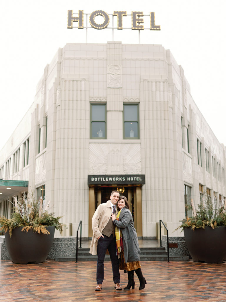 Couple Posing in Front of The Bottleworks Hotel