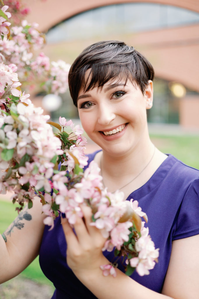Senior Picture in Indianapolis with Blossoming Tree at IUPUI